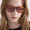 Prada Sunglasses with the Iconic Metal Plaque