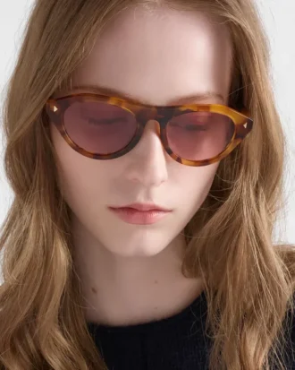 Prada Sunglasses with the Iconic Metal Plaque