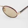 Prada Sunglasses with the Iconic Metal Plaque
