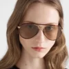 Prada Sunglasses with the Iconic Metal Plaque